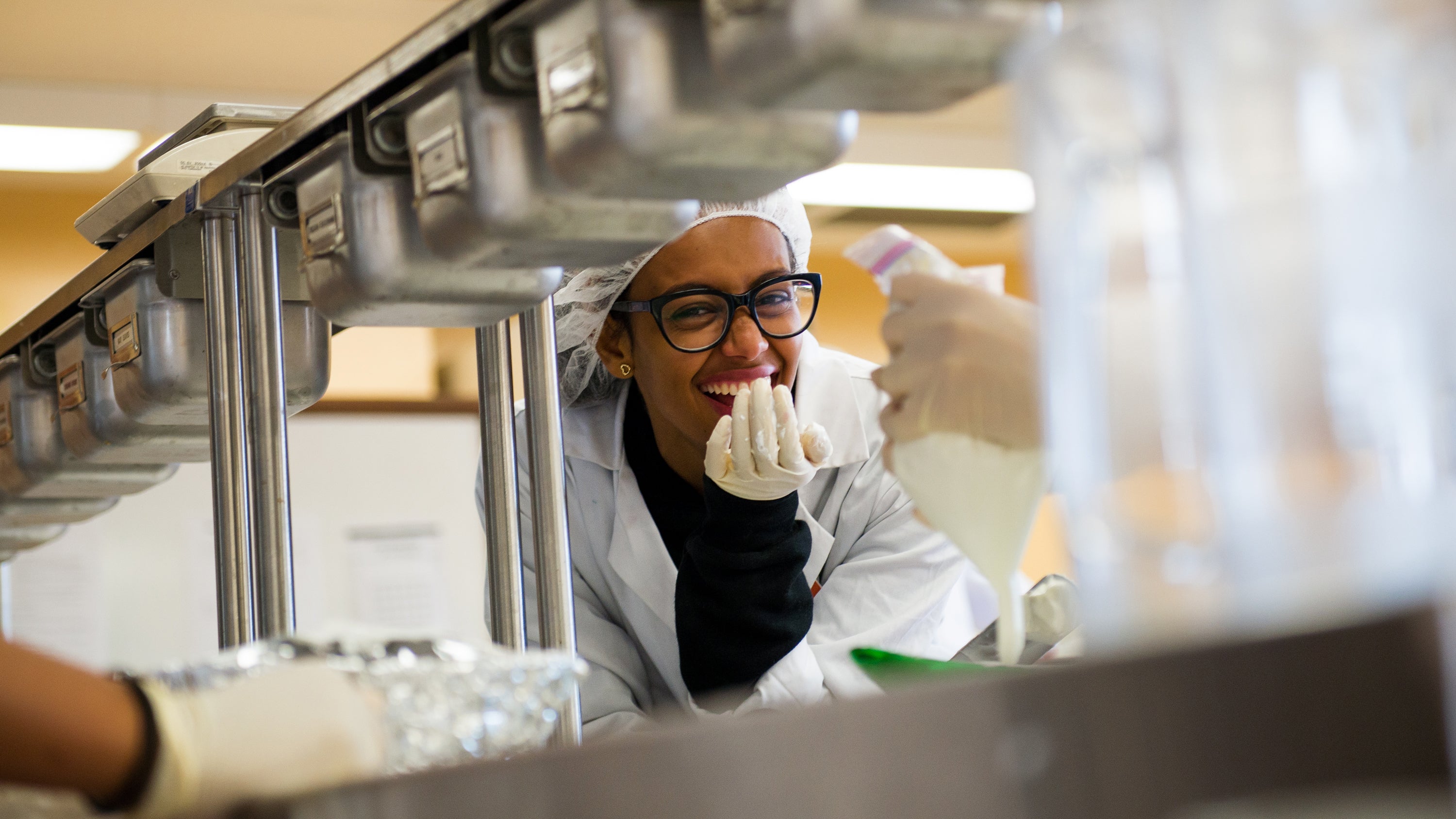 Smiling student in a laboratory.